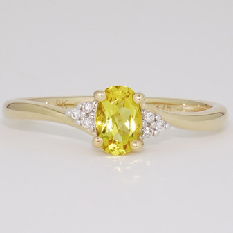 9ct gold oval cut heliodor and round brilliant cut diamond twist ring