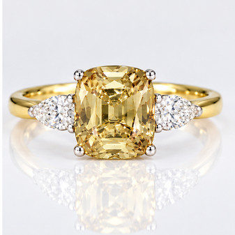 18ct gold and platinum cushion cut yellow sapphire and pear cut diamond ring
