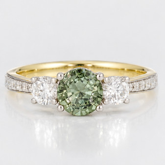 18ct gold and platinum round cut green sapphire and round brilliant cut diamond ring with diamond-set shoulders