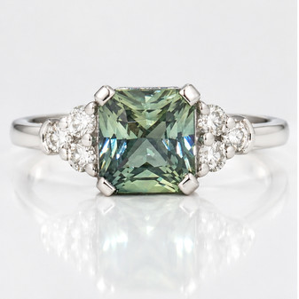 Platinum unheated radiant cut green sapphire and round brilliant cut diamond ring