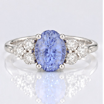Platinum oval cut Ceylon sapphire and round brilliant cut diamond ring