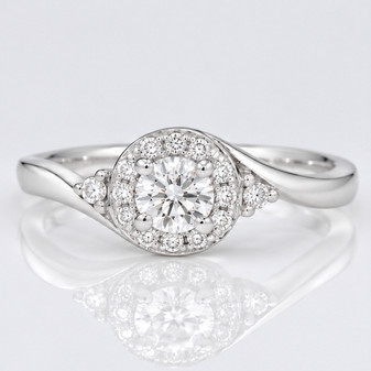 Platinum round brilliant cut diamond cluster twist ring