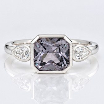 Platinum rubover-set radiant cut grey spinel and pear cut diamond ring