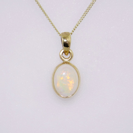 9ct yellow gold oval opal pendant with rubover setting PE5213