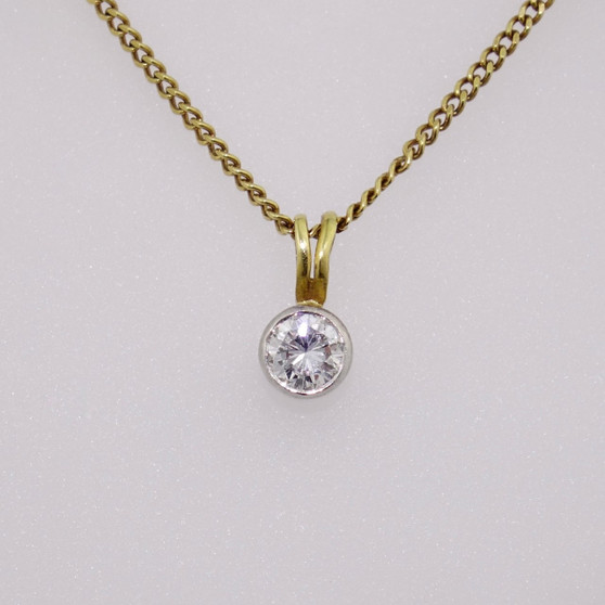 18ct gold diamond solitaire pendant with rubover setting