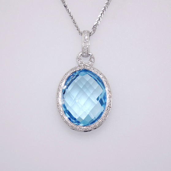 9ct white gold blue topaz and diamond pendant PE4611