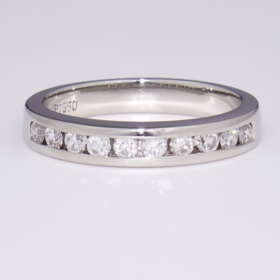 Platinum ring with ten round brilliant cut diamonds in channel setting ET1090