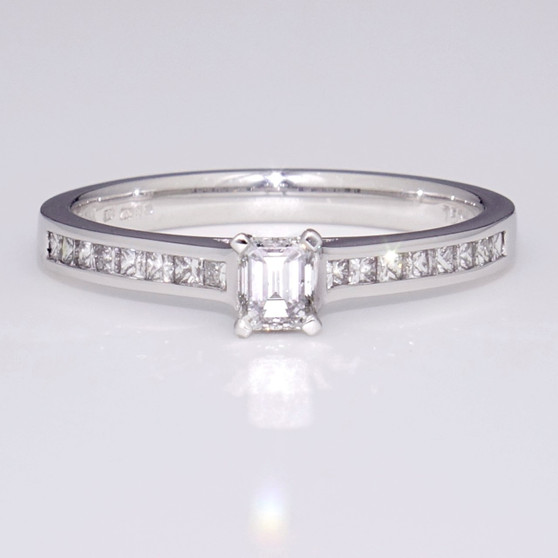 18ct white gold emerald cut diamond solitaire ring with diamond-set shoulders GR3793