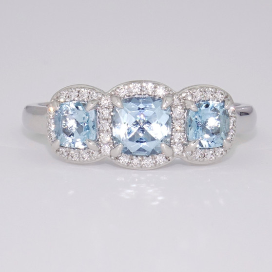 Platinum aquamarine and diamond cushion cut triple halo ring