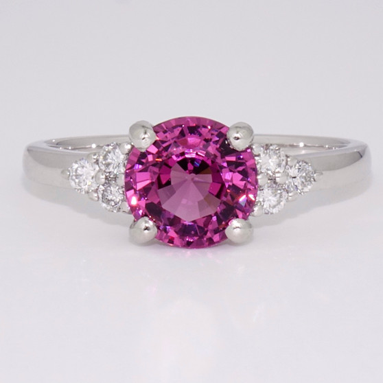 Platinum fuchsia garnet and round brililant cut diamond ring