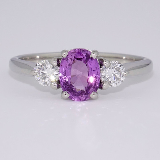 Platinum oval cut purple sapphire and diamond ring