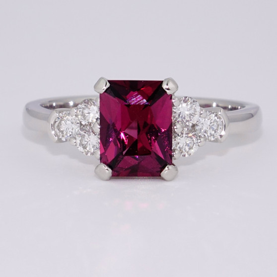 Platinum scissor cut raspberry garnet and round brilliant cut diamond ring