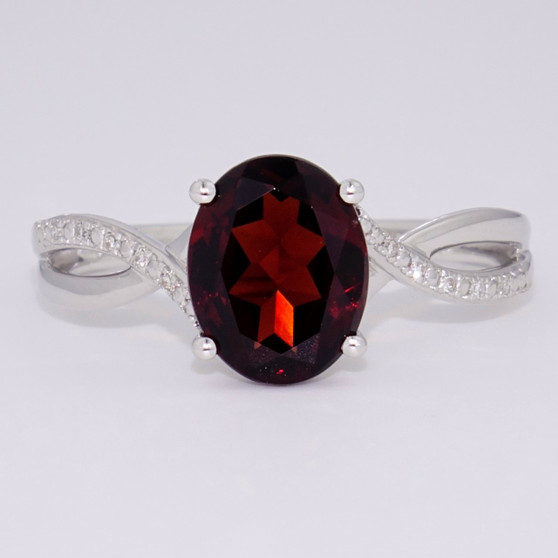 9ct white gold oval cut garnet and diamond ring