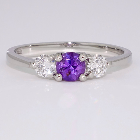 Platinum round cut unheated purple sapphire and round brilliant cut diamond ring