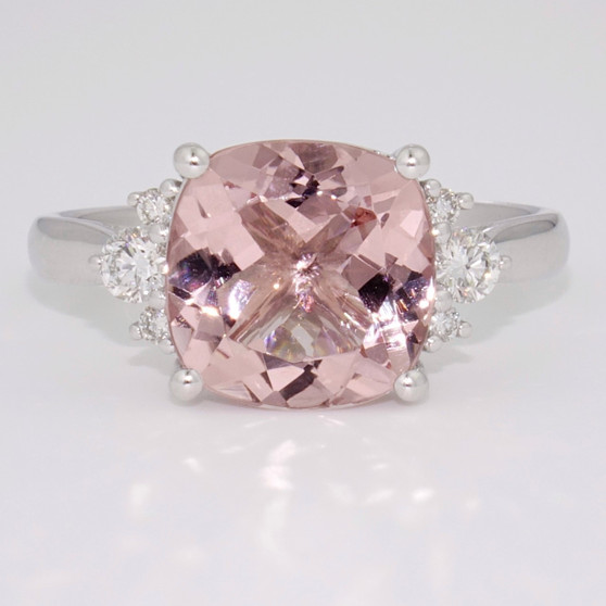 Unique platinum cushion cut morganite and round brilliant cut diamond ring