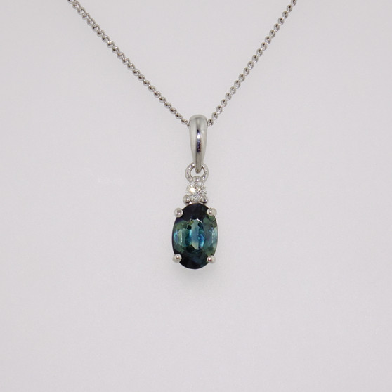 9ct white gold oval cut teal sapphire and round brilliant cut diamond pendant