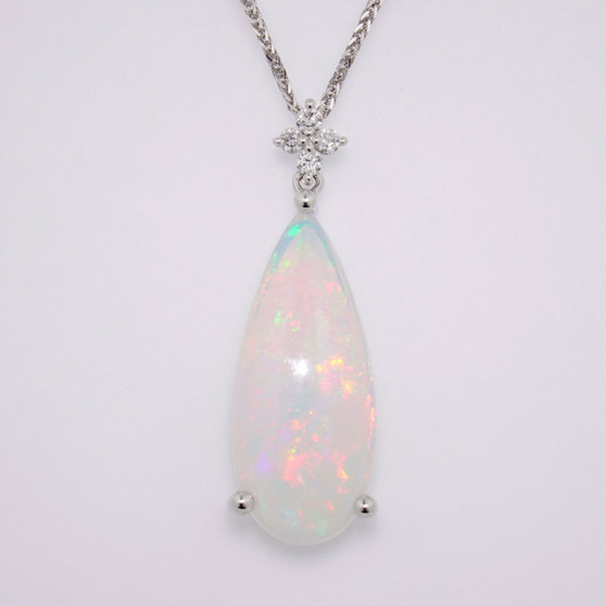 Unique 9ct white gold opal and diamond pendant