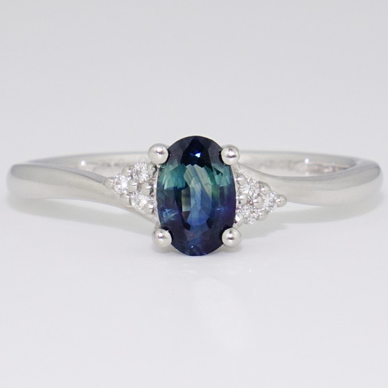 Platinum teal sapphire and diamond twist ring