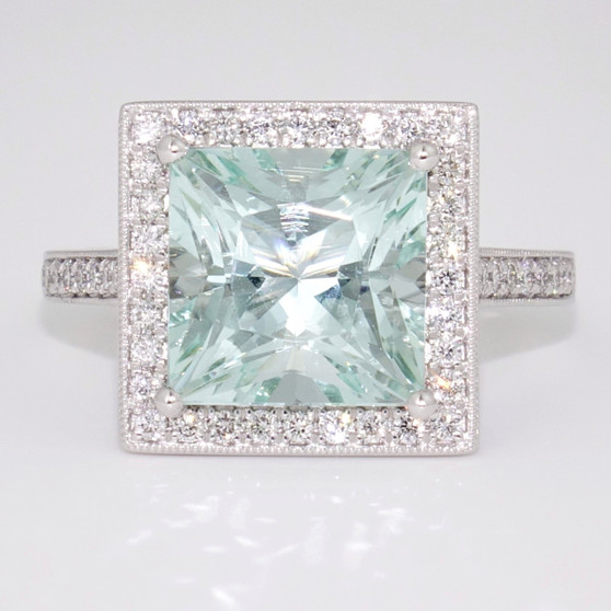 Unique platinum radiant cut unheated aquamarine and diamond halo ring