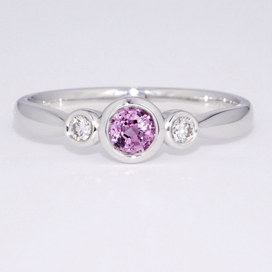 9ct white gold pink sapphire and diamond rubover set ring