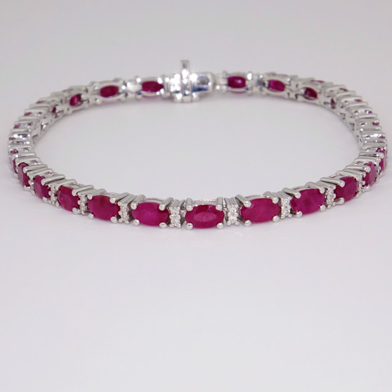 9ct white gold oval cut ruby and round brilliant cut diamond bracelet