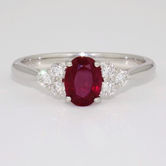 Platinum oval cut ruby and round brilliant cut diamond ring