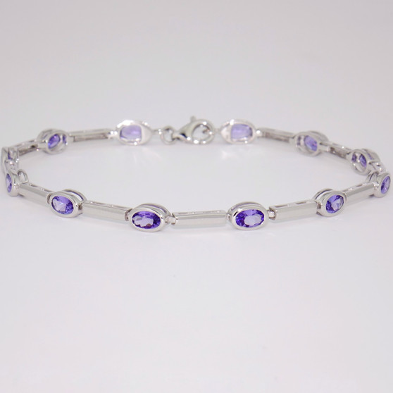 9ct white gold oval cut tanzanite rubover bar bracelet