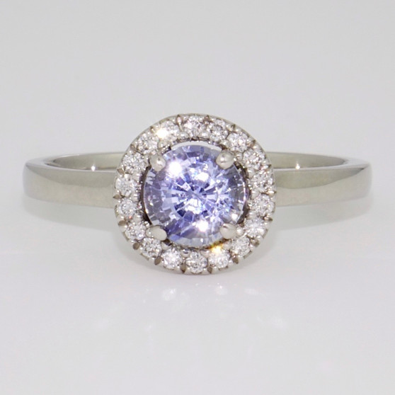 Platinum round cut Ceylon sapphire and diamond halo ring