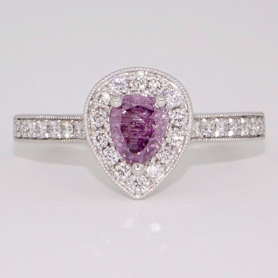 Unique platinum certificated fancy intense pink-purple pear cut diamond halo ring with diamond-set shoulders