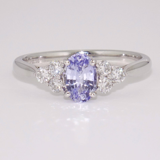 Platinum unheated oval cut Ceylon sapphire and round brilliant cut diamond ring