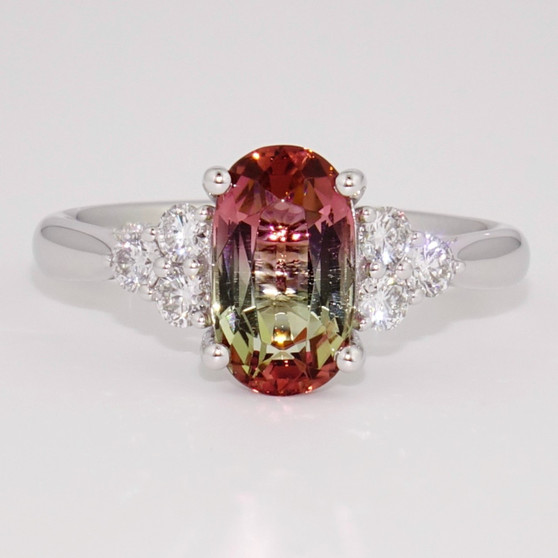 Platinum oval cut bi-colour tourmaline and round brilliant cut diamond ring