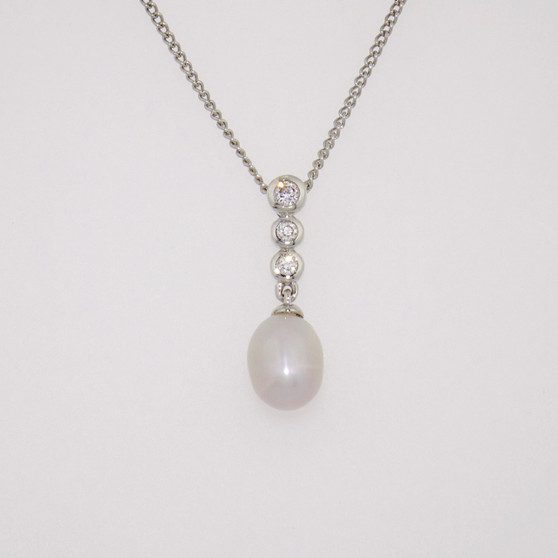 18ct white gold Scottish freshwater pearl and three rubover-set diamond pendant