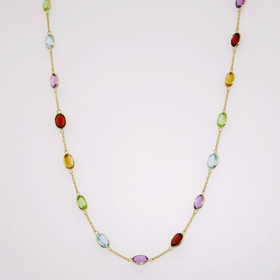 18ct gold oval cut amethyst, citrine, blue topaz, peridot and garnet necklace.