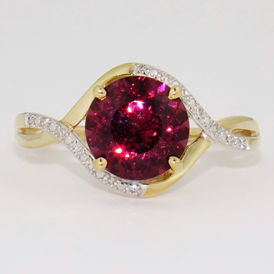 9ct gold round cut raspberry garnet and diamond twist ring