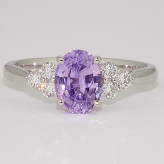 Platinum oval cut purple sapphire and round brilliant cut diamond ring