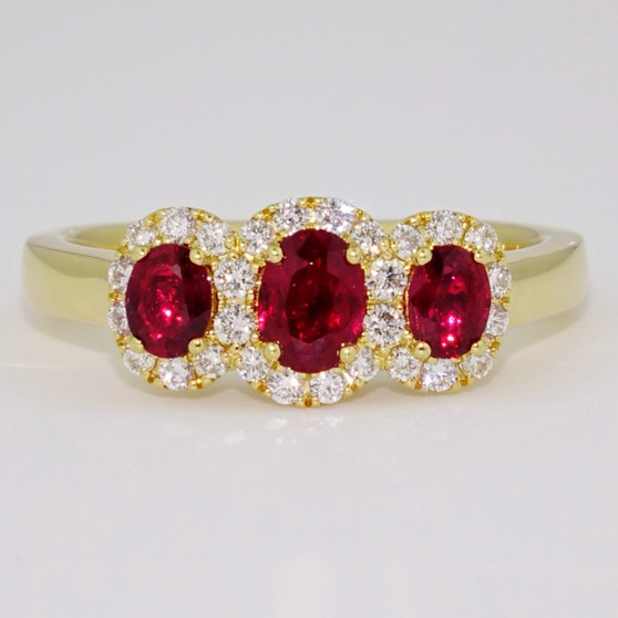 18ct gold unheated oval cut Burmese ruby triple diamond cluster ring