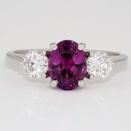 Platinum certificated unheated oval cut purple sapphire and round brilliant cut diamond ring
