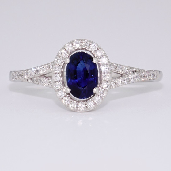 18ct white gold oval cut sapphire and diamond cluster ring with diamond shoulders