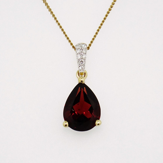 9ct gold pear cut garnet pendant with diamond-set bail