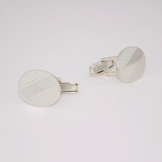 Oval sterling silver cufflinks with engine turned pattern