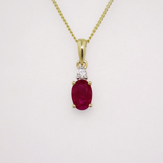 9ct gold oval cut ruby and round brilliant cut diamond pendant