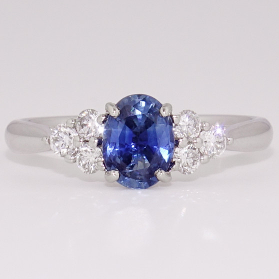 Platinum oval cut Ceylon sapphire and round brilliant cut diamond ring