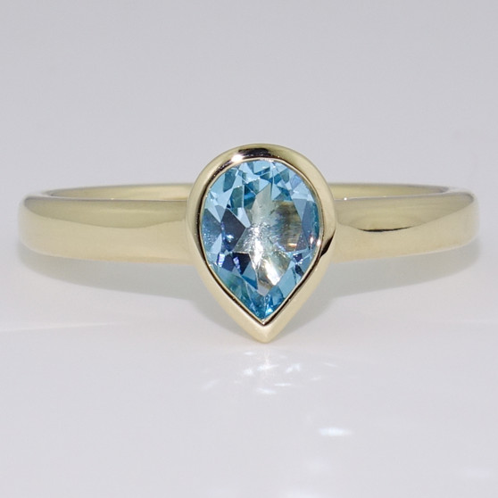 9ct gold pear cut blue topaz rubover ring 9ct gold pear cut blue topaz rubover ring