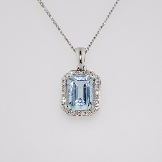 18ct white gold emerald cut aquamarine and diamond halo pendant