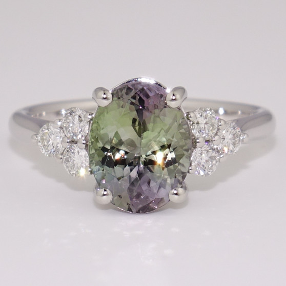 Platinum unheated oval cut mermaid tanzanite and six round brilliant cut diamond ring