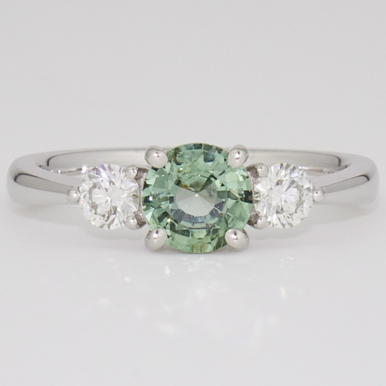 Platinum round cut green sapphire and round brilliant cut diamond ring