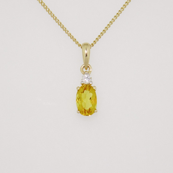 9ct gold oval cut heliodor and round brilliant cut diamond pendant