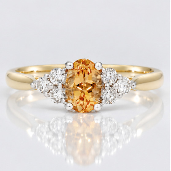 9ct gold oval cut Imperial topaz and round brilliant cut diamond ring