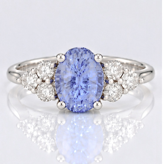 Platinum oval cut Ceylon sapphire and round brilliant cut diamond ring
