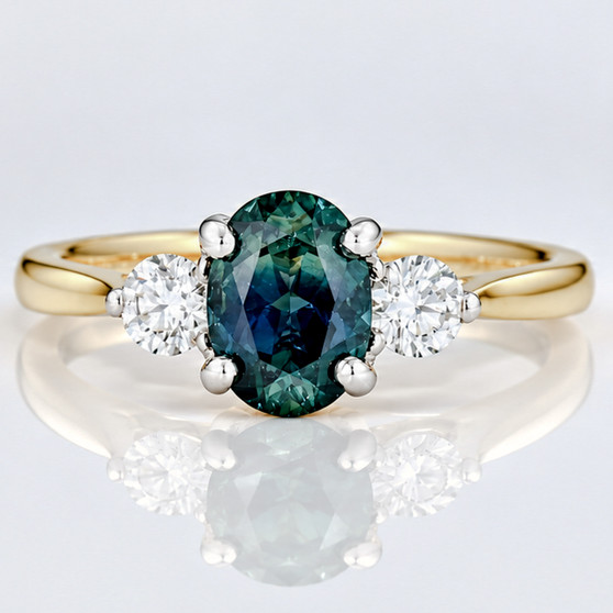 18ct gold oval cut teal sapphire and round brilliant cut diamond ring